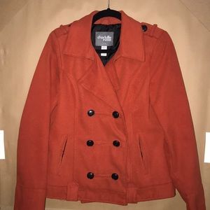 Burnt orange pea coat with brown buttons